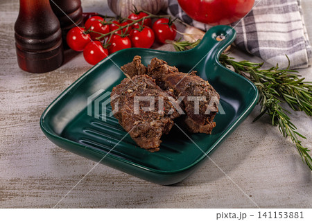 Slow cooked beef cheeks on green plate with fresh vegetables Slow cooked beef cheeks on green plate with fresh vegetables 141153881