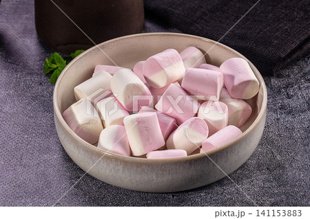 Pink white marshmallows in ceramic bowl. Soft sweet candy dessert snack 141153883