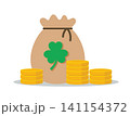 Gold Coins Stack and Money Bag with Shamrock 141154372