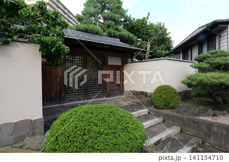 Japanese Residential Street with Modern Family Houses in Quiet Neighborhood Japanese Residential Street with Modern Family Houses in Quiet Neighborhood 141154710