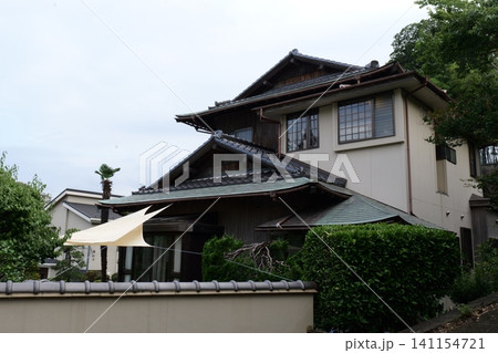 Japanese Residential Street with Modern Family Houses in Quiet Neighborhood Japanese Residential Street with Modern Family Houses in Quiet Neighborhood 141154721