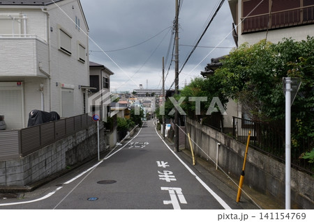 Japanese Residential Street with Modern Family Houses in Quiet Neighborhood Japanese Residential Street with Modern Family Houses in Quiet Neighborhood 141154769