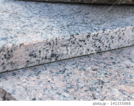 Pink granite stone slab closeup speckled texture natural building material Pink granite stone slab closeup speckled texture natural building material 141155068