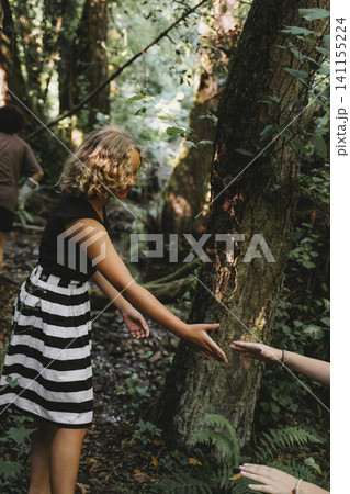 Helping Hand Reaching Out in a Forest Setting 141155224