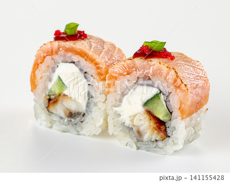 Salmon sushi rolls with cream cheese and tobiko on white background Salmon sushi rolls with cream cheese and tobiko on white background 141155428
