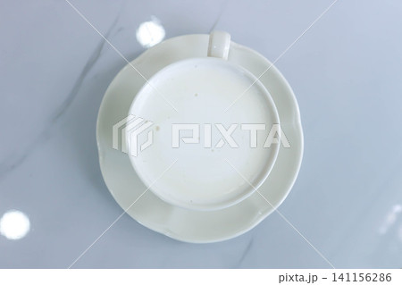 hot milk or a cup of milk 141156286