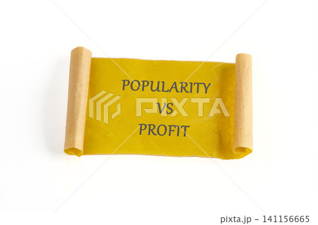 A scroll displays the words popularity vs profit. This scene shows a simple representation of a business topic. The scroll is rolled at both ends for a clear view A scroll displays the words popularity vs profit. This scene shows a simple representation of a business topic. The scroll is rolled at both ends for a clear view 141156665