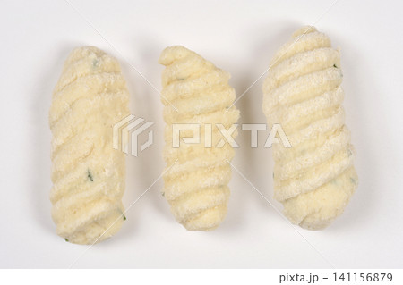 Three Pieces of Raw Cottage Cheese Gnocchi with Chives Three Pieces of Raw Cottage Cheese Gnocchi with Chives 141156879