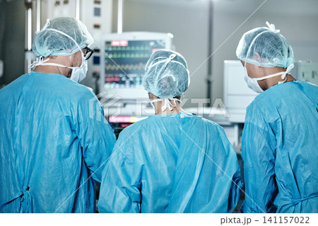 Surgery, group or surgeons with teamwork for emergency, accident or healthcare in hospital clinic. Heart rate monitor, back or doctors in surgical collaboration for operating, support or medical help Surgery, group or surgeons with teamwork for emergency, accident or healthcare in hospital clinic. Heart rate monitor, back or doctors in surgical collaboration for operating, support or medical help 141157022