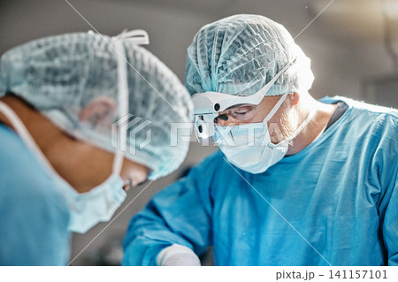 Surgery, operation or surgeons with teamwork for emergency, accident or healthcare help in hospital clinic. Theatre procedure, icu or doctors in surgical collaboration in operating room to support Surgery, operation or surgeons with teamwork for emergency, accident or healthcare help in hospital clinic. Theatre procedure, icu or doctors in surgical collaboration in operating room to support 141157101