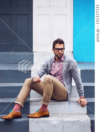 Serious, fashion and man on stairs in city with stylish, elegant and trendy outfit with confidence. Pride, glasses and person with classy cardigan, shirt and shoes for style by steps in urban town. Serious, fashion and man on stairs in city with stylish, elegant and trendy outfit with confidence. Pride, glasses and person with classy cardigan, shirt and shoes for style by steps in urban town. 141157135