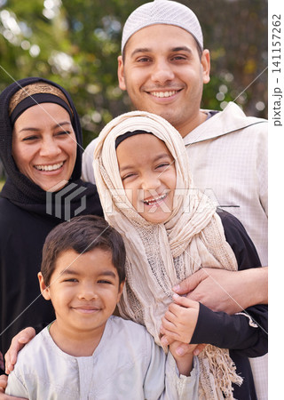 Park, muslim family and portrait of parents with children for bonding, ramadan and outdoors together. Islam, happy people and mother or father with kids for love, childcare and support in nature Park, muslim family and portrait of parents with children for bonding, ramadan and outdoors together. Islam, happy people and mother or father with kids for love, childcare and support in nature 141157262
