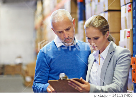 Writing, clipboard or business people at warehouse for logistic, delivery or cargo, shipping or planning. Factory, supply chain or managers with paper checklist for retail, stock or procurement notes Writing, clipboard or business people at warehouse for logistic, delivery or cargo, shipping or planning. Factory, supply chain or managers with paper checklist for retail, stock or procurement notes 141157400
