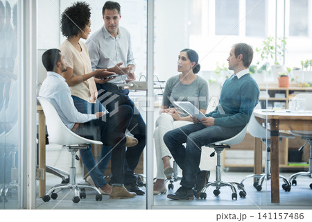 Employees, talking and office for meeting or planning for teamwork and profession in organisation. Diverse people or colleagues for discussion and career for employment and ideas for company indoor 141157486