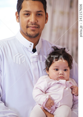 Muslim, home and portrait of father with baby for bonding, ramadan and calm together. Parenting, happy family and Islamic dad with newborn infant for love, childcare or support in living room Muslim, home and portrait of father with baby for bonding, ramadan and calm together. Parenting, happy family and Islamic dad with newborn infant for love, childcare or support in living room 141157606