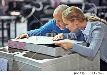 Printing, warehouse and people with paper for inspection, collaboration and quality control. Factory, supply chain and man and woman for logistics, manufacturing and industrial production in workshop Printing, warehouse and people with paper for inspection, collaboration and quality control. Factory, supply chain and man and woman for logistics, manufacturing and industrial production in workshop 141157627