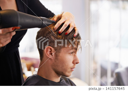Customer, hairdryer and man with hairdresser for professional haircare, styling or drying with luxury treatment. Grooming, hair and client at salon for care, wellness and small business with service 141157645