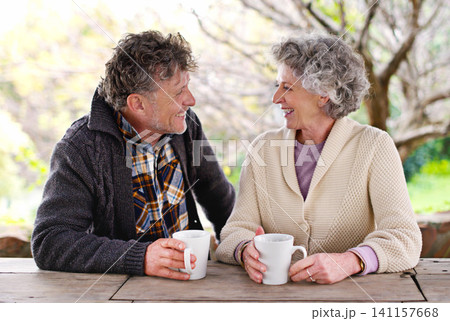 Senior couple, conversation or coffee to relax in garden as happy, communication or bonding together. Elderly man, woman or smile at hot, drink or table to talk of retirement, marriage or commitment Senior couple, conversation or coffee to relax in garden as happy, communication or bonding together. Elderly man, woman or smile at hot, drink or table to talk of retirement, marriage or commitment 141157668