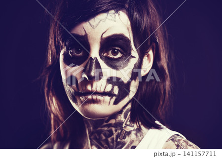 Skull, makeup and portrait of woman on black background for festival, Halloween and day of the dead. Creative art, skeleton and person with face paint for horror, scary and gothic aesthetic in studio Skull, makeup and portrait of woman on black background for festival, Halloween and day of the dead. Creative art, skeleton and person with face paint for horror, scary and gothic aesthetic in studio 141157711