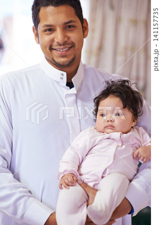 Muslim, family and portrait of father with baby in home for bonding, relationship and calm together. Parenting, happy and Islamic dad with newborn infant for love, childcare or support in living room 141157735