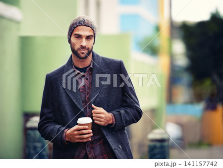 Fashion, portrait or man in street with coffee or coat for edgy clothes, outdoor travel or elegant style in winter outfit. City, drink or stylish guy in urban town in beanie or trendy jacket in Italy Fashion, portrait or man in street with coffee or coat for edgy clothes, outdoor travel or elegant style in winter outfit. City, drink or stylish guy in urban town in beanie or trendy jacket in Italy 141157742