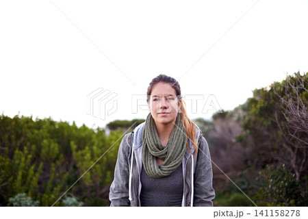 Portrait, outdoor and hiking with woman, wellness and relaxing with stress relief and weekend break with hobby. Face, person and hiker with flowers and healthy with nature and landscape with fitness 141158278