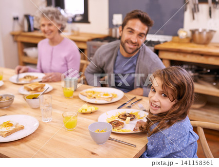 Love, breakfast and family in portrait or kitchen with food, eating or bonding together at table. Meal, pancakes and father or grandmother with child for brunch, nutrition or communication at home 141158361