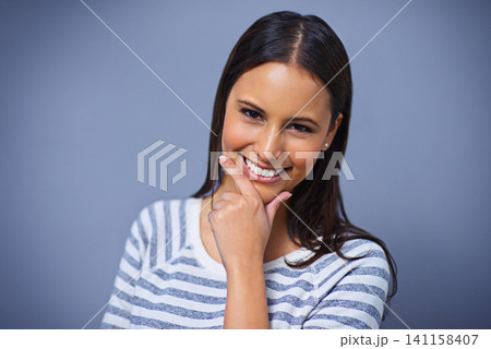 Woman, happy and positive in studio portrait for university, proud and playful on blue background. Female person, mockup space and smile for student satisfaction, confidence and playful enjoyment 141158407