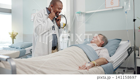 Consultation, stethoscope and doctor with patient in hospital after surgery, treatment or procedure. Discussion, checkup and African male medical worker talk to senior man in clinic bed for diagnosis Consultation, stethoscope and doctor with patient in hospital after surgery, treatment or procedure. Discussion, checkup and African male medical worker talk to senior man in clinic bed for diagnosis 141158697
