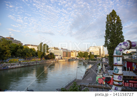 Vienna, Austria - June 13, 2023: Embankment the Danube Canal in Vienna Vienna, Austria - June 13, 2023: Embankment the Danube Canal in Vienna 141158727