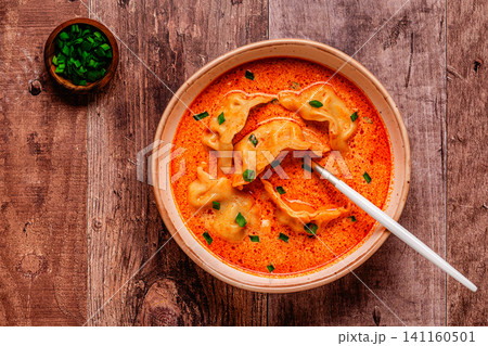 Coconut creamy dumpling soup or curry dumpling soup. Coconut creamy dumpling soup or curry dumpling soup. 141160501