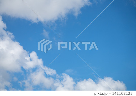 Beautiful blue sky and white cumulus clouds abstract background. Cloudscape background. Blue sky and fluffy white clouds on sunny days. Blue sky and daylight. World Ozone Day. Ozone layer. Summer sky. Beautiful blue sky and white cumulus clouds abstract background. Cloudscape background. Blue sky and fluffy white clouds on sunny days. Blue sky and daylight. World Ozone Day. Ozone layer. Summer sky. 141162123
