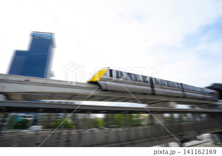 Elevated monorail train fast move on rail. Public transit monorail. Modern mass transit. Rail transportation. Driverless straddle monorail. Monorail technology. Rapid transit in city. Urban transport. 141162169