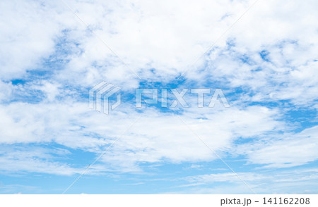 Beautiful blue sky and white clouds abstract background. Cloudscape background. Blue sky and fluffy white clouds on sunny day with birds flying. Nature weather. Beautiful blue sky on a summer day. Beautiful blue sky and white clouds abstract background. Cloudscape background. Blue sky and fluffy white clouds on sunny day with birds flying. Nature weather. Beautiful blue sky on a summer day. 141162208