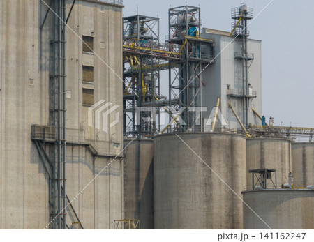 Animal feed factory. Agricultural silos, grain storage silos. Agriculture industry. Rural agribusiness. Grain storage innovation. Agricultural silos at animal feed factory. Sustainable farming. Animal feed factory. Agricultural silos, grain storage silos. Agriculture industry. Rural agribusiness. Grain storage innovation. Agricultural silos at animal feed factory. Sustainable farming. 141162247