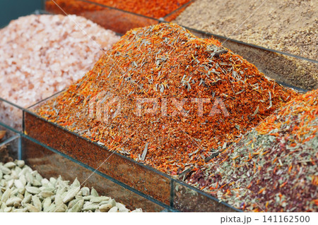 Vibrant spices displayed at a market in the afternoon Vibrant spices displayed at a market in the afternoon 141162500