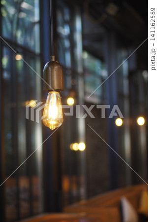 Cafe light fixture with glass walls and wood seats 141162589