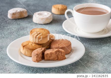 Polvorones and mantecados with hot chocolate cozy festive dessert winter scene Polvorones and mantecados with hot chocolate cozy festive dessert winter scene 141162635