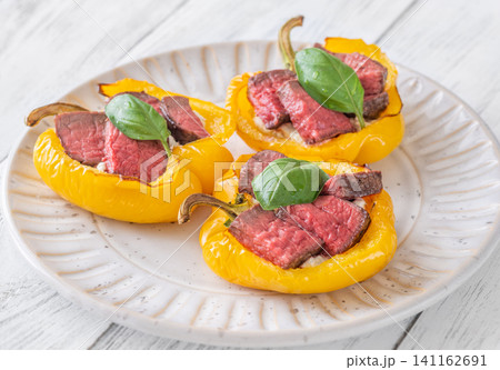 Roasted Yellow Bell Peppers Stuffed With Cream Cheese And Juicy Steak Slices Roasted Yellow Bell Peppers Stuffed With Cream Cheese And Juicy Steak Slices 141162691