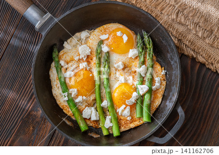 Rustic Breakfast Skillet With Fried Eggs Asparagus And Feta Cheese Rustic Breakfast Skillet With Fried Eggs Asparagus And Feta Cheese 141162706