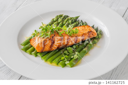 Grilled Salmon Fillet With Fresh Asparagus On Elegant White Plate Grilled Salmon Fillet With Fresh Asparagus On Elegant White Plate 141162725