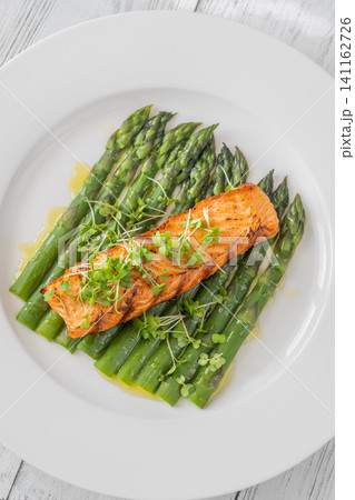 Grilled Salmon Fillet With Fresh Asparagus On Elegant White Plate Grilled Salmon Fillet With Fresh Asparagus On Elegant White Plate 141162726