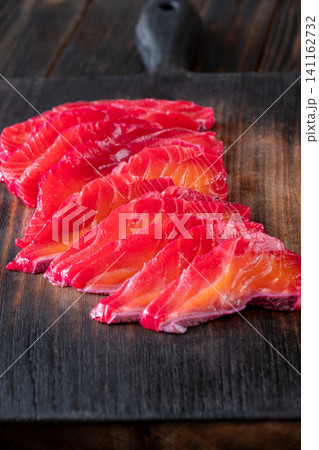 Gourmet Beetroot Gravlax Slices On Dark Wooden Background Premium Presentation 141162732