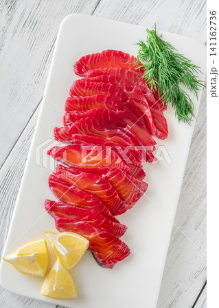 Premium Nordic Salmon Gravlax Appetizer With Herbs And Citrus Garnish Premium Nordic Salmon Gravlax Appetizer With Herbs And Citrus Garnish 141162736