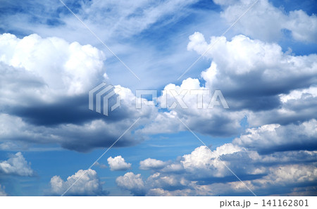 Beautiful blue sky with fluffy white cumulus clouds and light wispy cirrus on a sunny day. Beautiful blue sky with fluffy white cumulus clouds and light wispy cirrus on a sunny day. 141162801