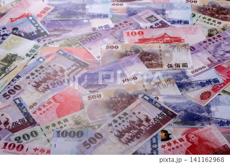 Taiwan, Taiwanese paper banknotes and coins, dollars of various denominations. Taiwanese dollars Taiwan, Taiwanese paper banknotes and coins, dollars of various denominations. Taiwanese dollars 141162968