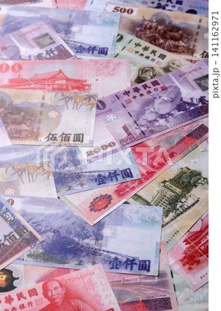Taiwan, Taiwanese paper banknotes and coins, dollars of various denominations. Taiwanese dollars Taiwan, Taiwanese paper banknotes and coins, dollars of various denominations. Taiwanese dollars 141162971
