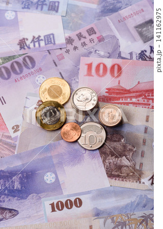 Taiwan, Taiwanese paper banknotes and coins, dollars of various denominations. Taiwanese dollars Taiwan, Taiwanese paper banknotes and coins, dollars of various denominations. Taiwanese dollars 141162975