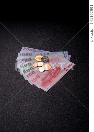 Taiwan, Taiwanese paper banknotes and coins, dollars of various denominations. Taiwanese dollars Taiwan, Taiwanese paper banknotes and coins, dollars of various denominations. Taiwanese dollars 141162991