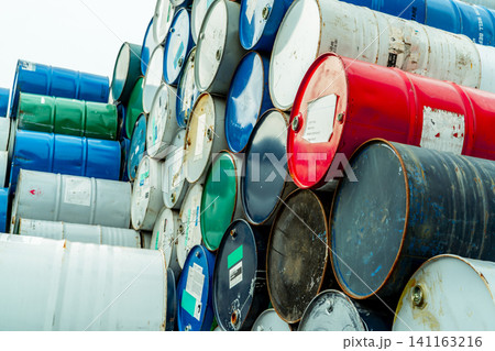 Old chemical barrels with flammable liquid warning label . Steel oil tank. Toxic waste in metal tank. Hazardous chemical barrel. Hazard waste storage in factory. Chemical barrels stack. Oil brent. Old chemical barrels with flammable liquid warning label . Steel oil tank. Toxic waste in metal tank. Hazardous chemical barrel. Hazard waste storage in factory. Chemical barrels stack. Oil brent. 141163216